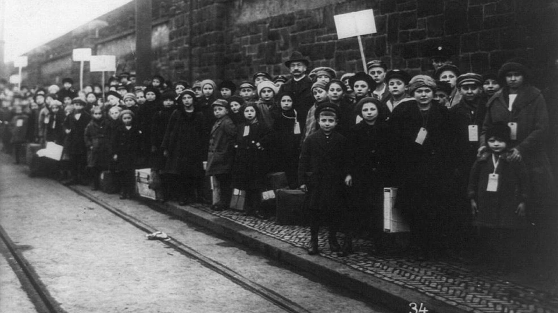 The Bread and Roses strike in Lawrence, Massachusetts, with many children posed on sidewalk, circa 1912.